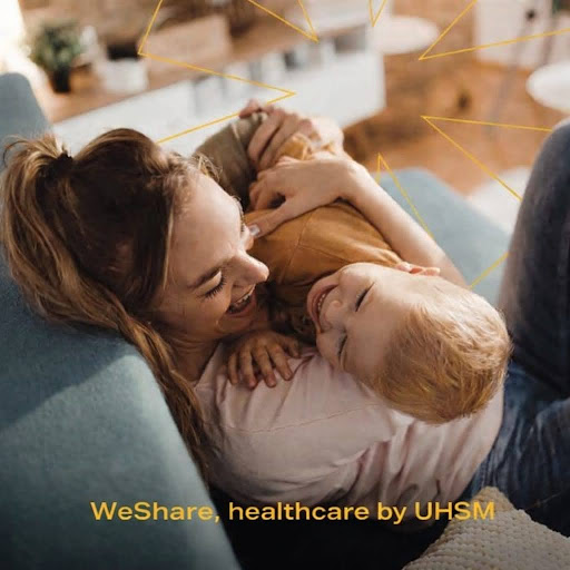 Mother and child laughing joyfully at home, reflecting maternity support